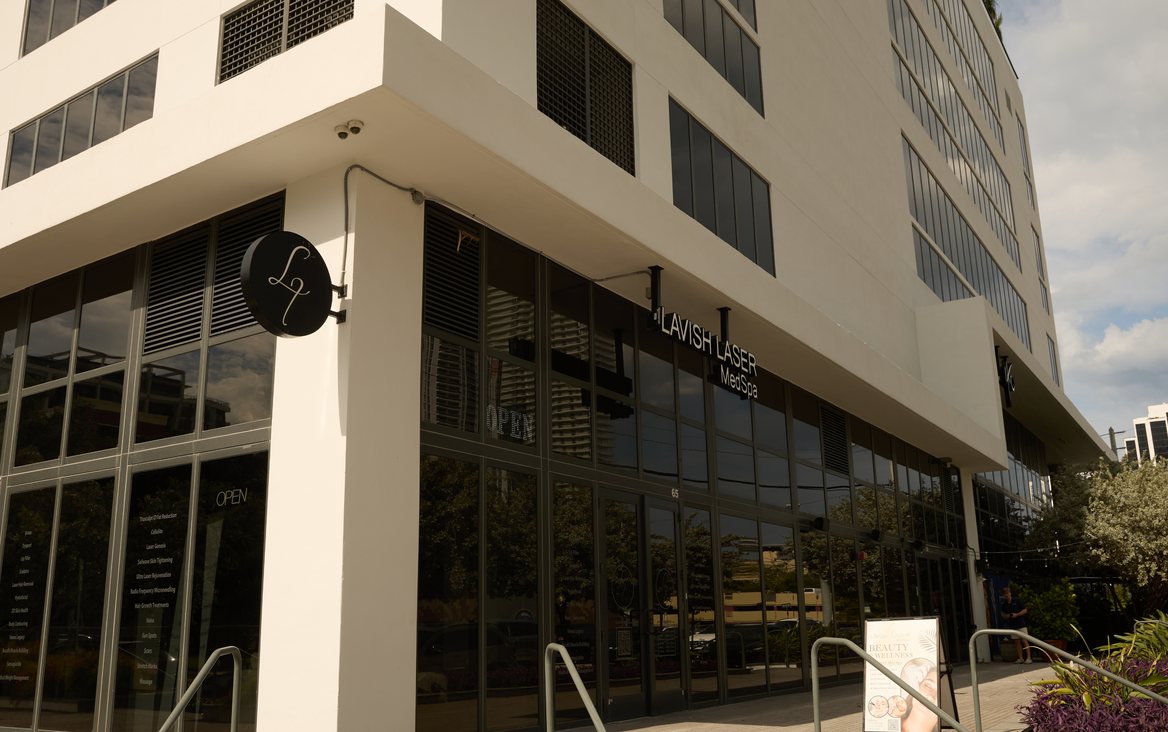Lavish Laser MedSpa Midtown Miami, a modern white building with the Lavish Laser sign on its corner